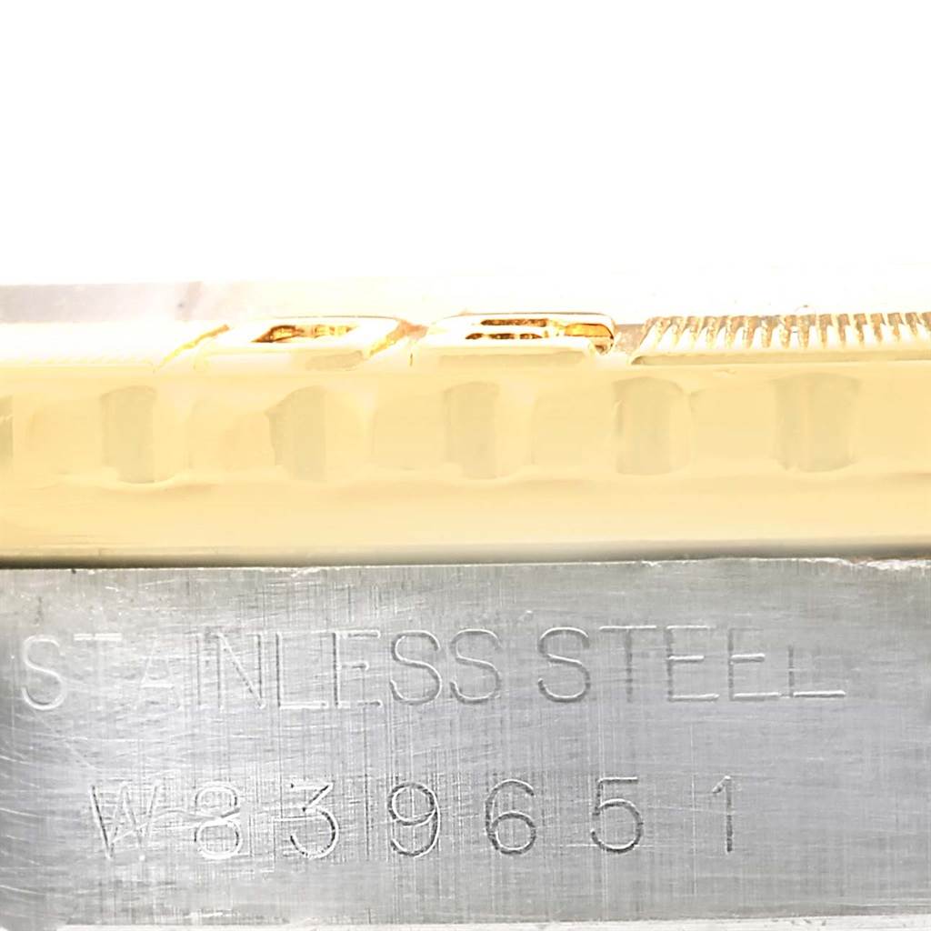 This close-up image shows the side view of the stainless steel case and part of the bracelet of a Rolex Datejust 16263 Men's Steel and Gold (two tone) Blue Dial 16263 Men's Steel and Gold (two tone) Blue Dial watch.