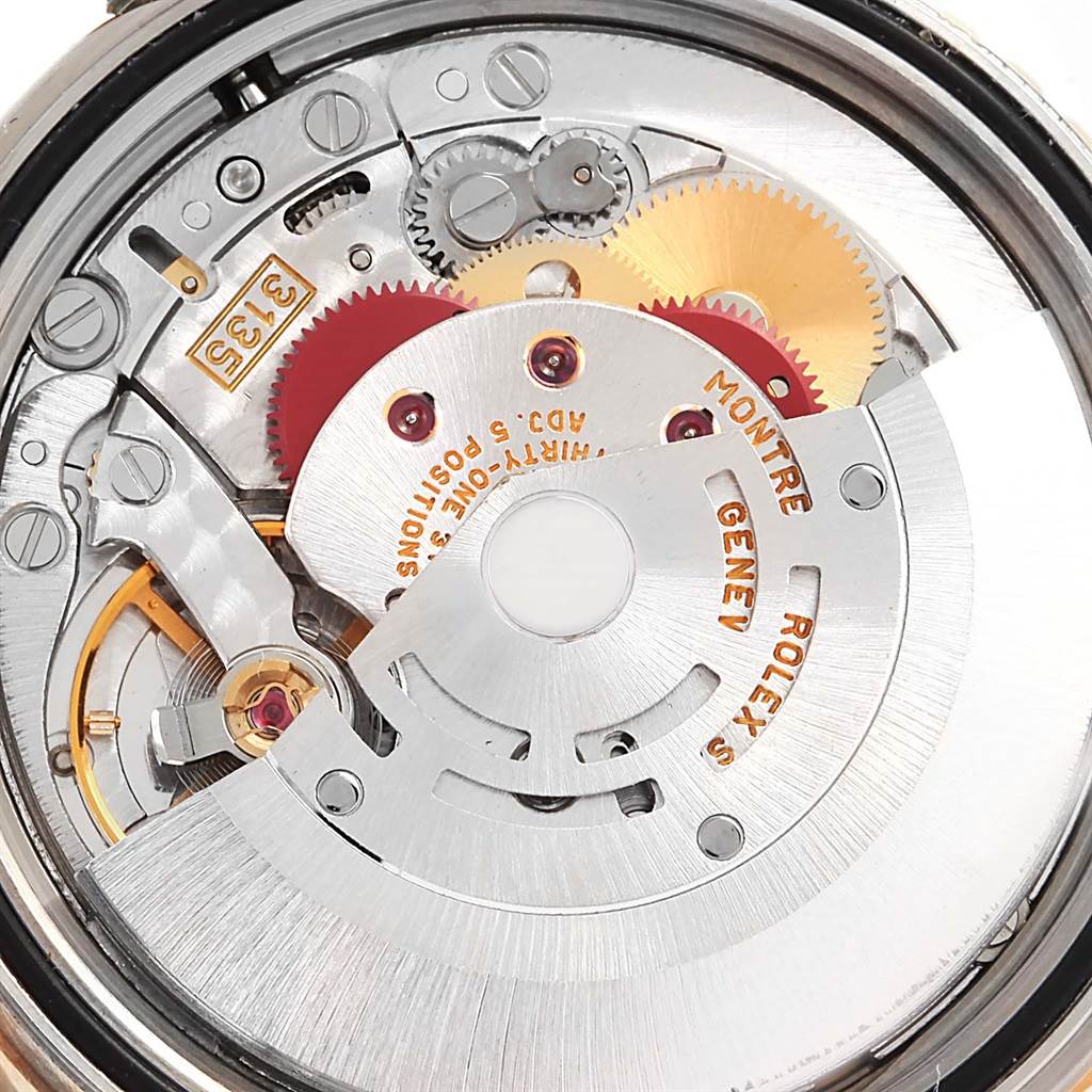 This image shows the intricate internal mechanism of the Rolex Datejust 16263 Men's Steel and Gold (two tone) Blue Dial 16263 Men's Steel and Gold (two tone) Blue Dial watch, viewed from the back with gears and components visible.