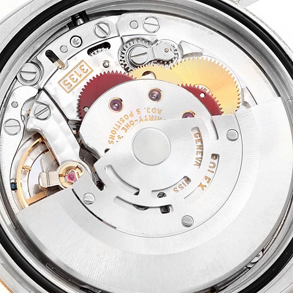 This image shows a close-up view of the movement and internal mechanics of a Rolex Datejust 116233 Men
s Stainless Steel Champagne Dial 116233 Men
s Stainless Steel Champagne Dial watch.