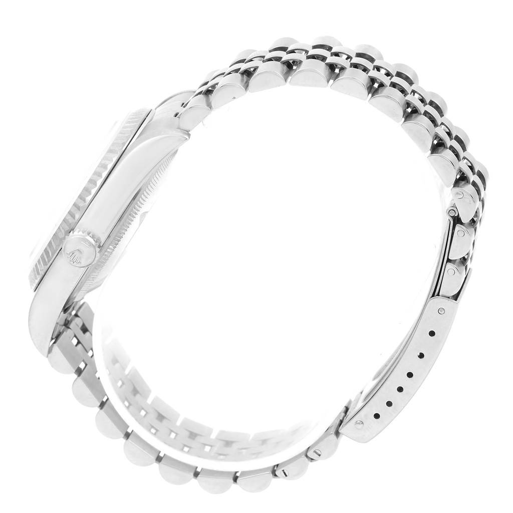 The image shows a side profile of a Rolex Datejust 16234 Men
s Stainless Steel Silver Dial 16234 Men
s Stainless Steel Silver Dial watch, highlighting the case, crown, and part of the bracelet.