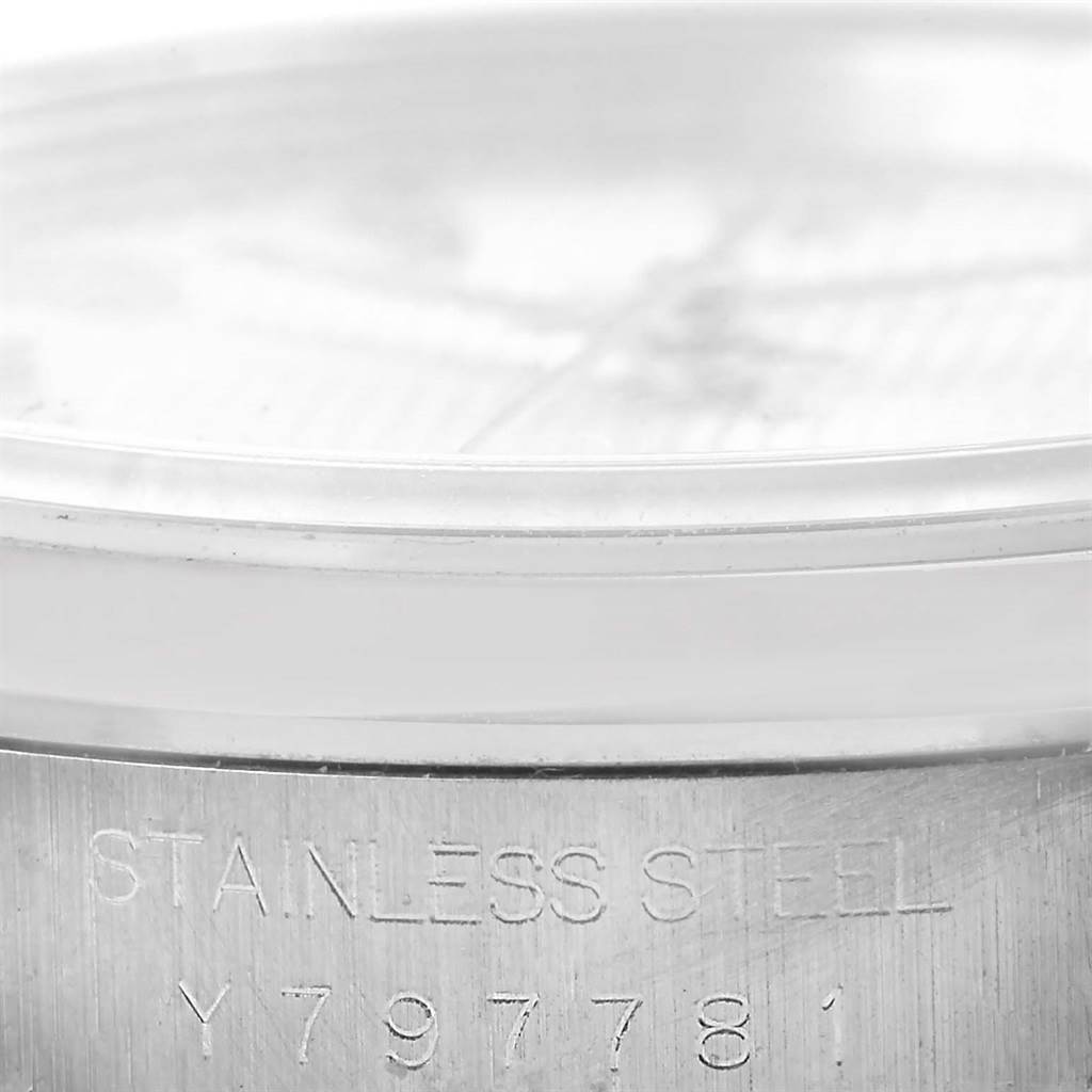 The image shows a close-up of the case back edge and serial number of a Rolex Datejust 16200 Men's Stainless Steel Silver Dial 16200 Men's Stainless Steel Silver Dial watch.