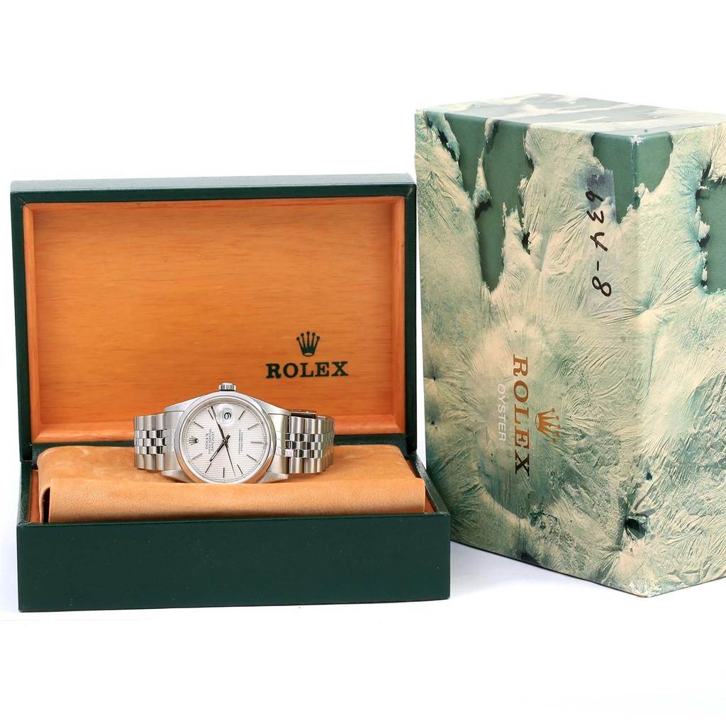 The image shows a Rolex Datejust 16200 Men's Stainless Steel Silver Dial 16200 Men's Stainless Steel Silver Dial watch, front view, in its open box with the outer packaging beside it.