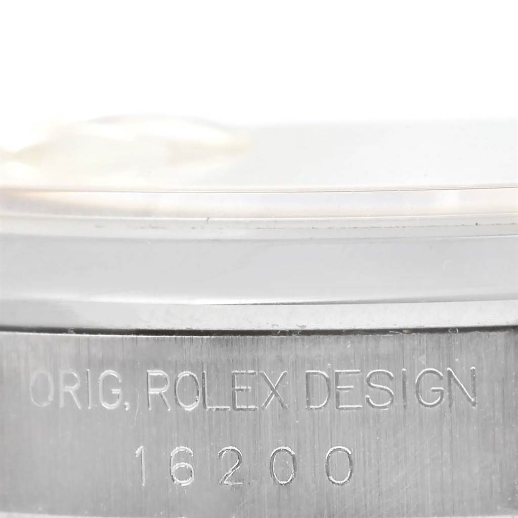 The image shows the side of the casing of a Rolex Datejust 16200 Men's Stainless Steel Silver Dial 16200 Men's Stainless Steel Silver Dial watch, highlighting the model number 16200 and "ORIG. ROLEX DESIGN" engraving.