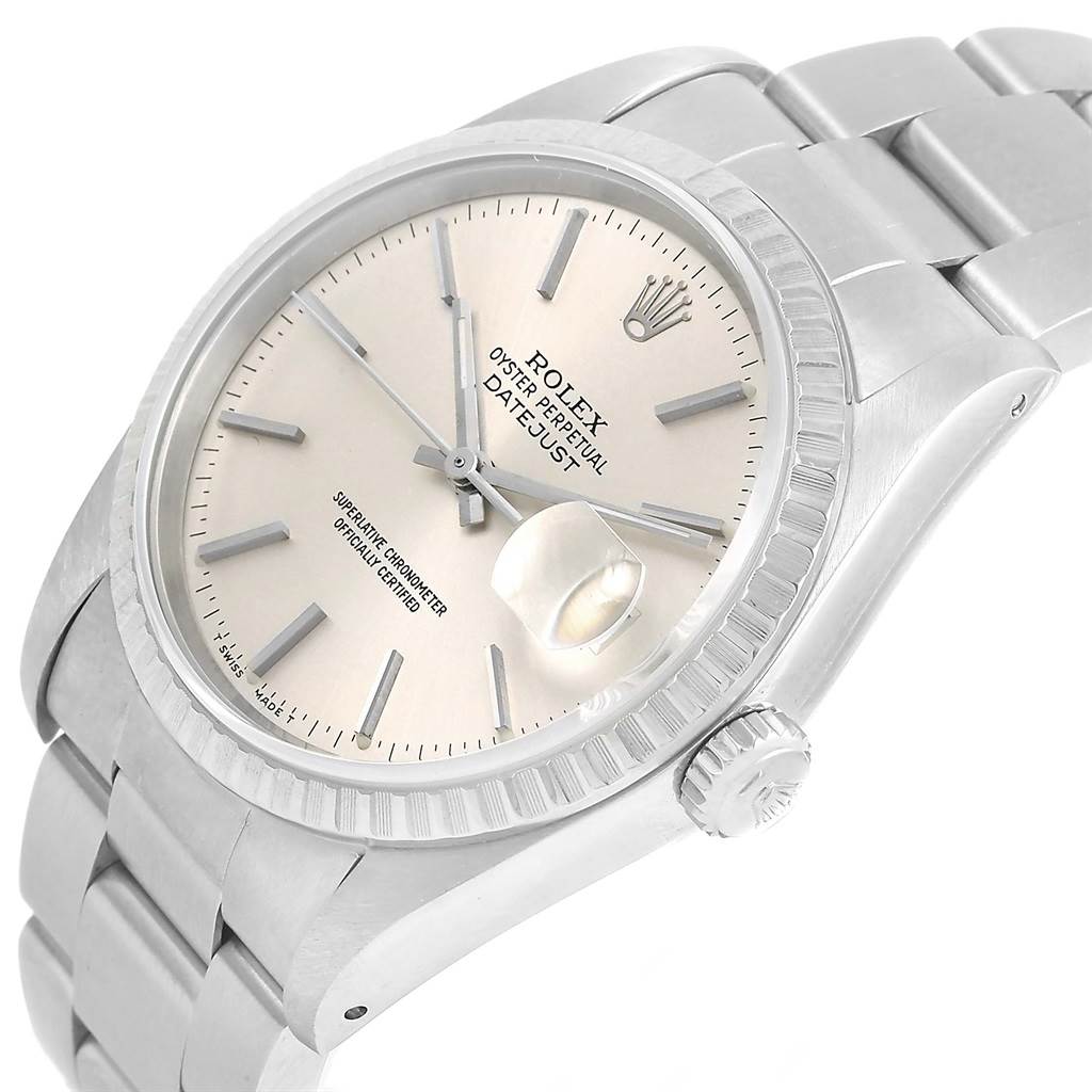 This image shows a Rolex Datejust 16220 Men
s Stainless Steel Silver Dial 16220 Men
s Stainless Steel Silver Dial model watch at an angled view, highlighting the dial, fluted bezel, bracelet, and crown.