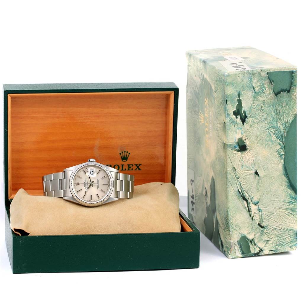 The image shows a Rolex Datejust 16220 Men
s Stainless Steel Silver Dial 16220 Men
s Stainless Steel Silver Dial watch displayed inside its open watch box with an additional outer box on the side.