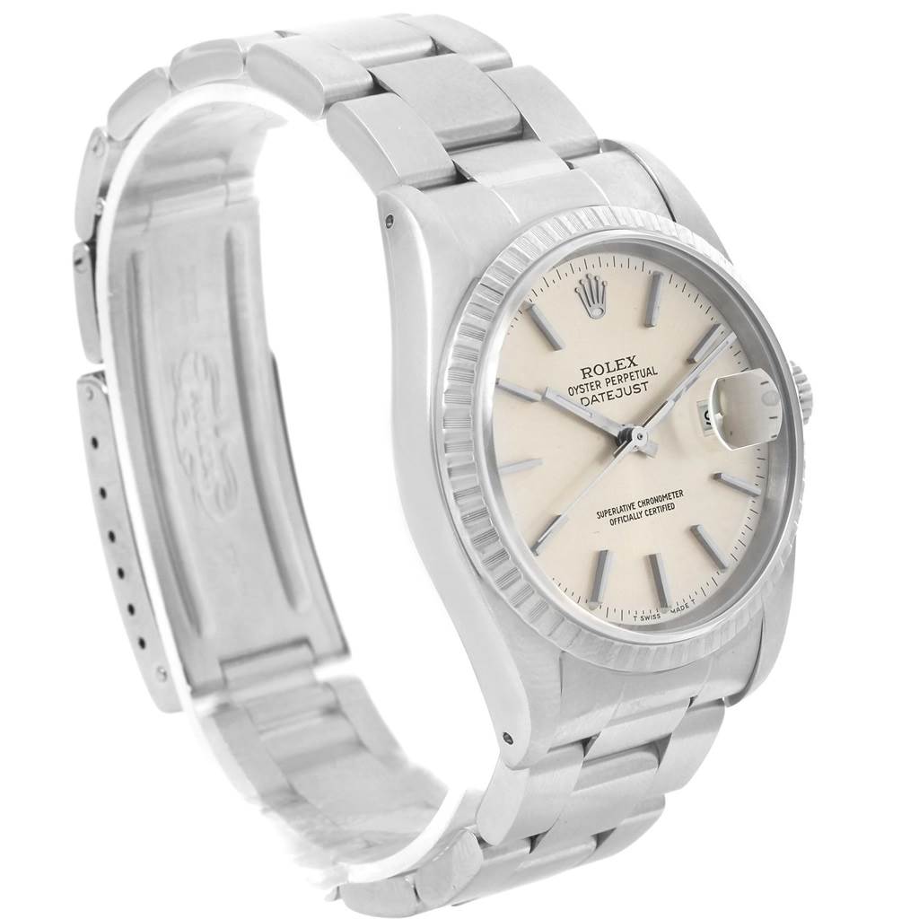The Rolex Datejust 16220 Men
s Stainless Steel Silver Dial 16220 Men
s Stainless Steel Silver Dial watch is shown at an angle highlighting the dial, bezel, and part of the bracelet.
