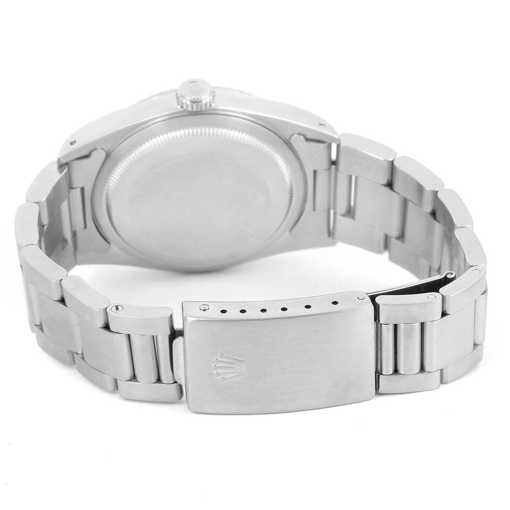 The image shows the back side and clasp of a Rolex Datejust 16220 Men
s Stainless Steel Silver Dial 16220 Men
s Stainless Steel Silver Dial watch, highlighting the case and bracelet.