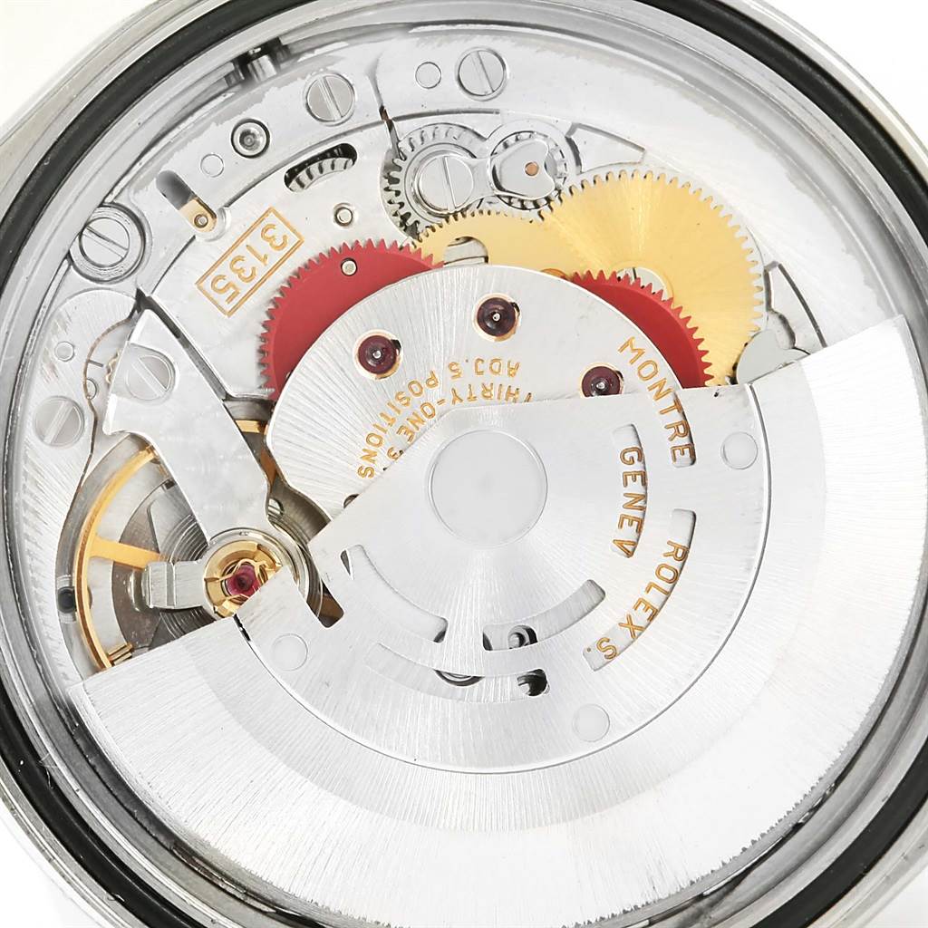 The image shows the intricate internal movement of a Rolex Datejust 16220 Men
s Stainless Steel White Dial 16220 Men
s Stainless Steel White Dial watch from a top-down angle.