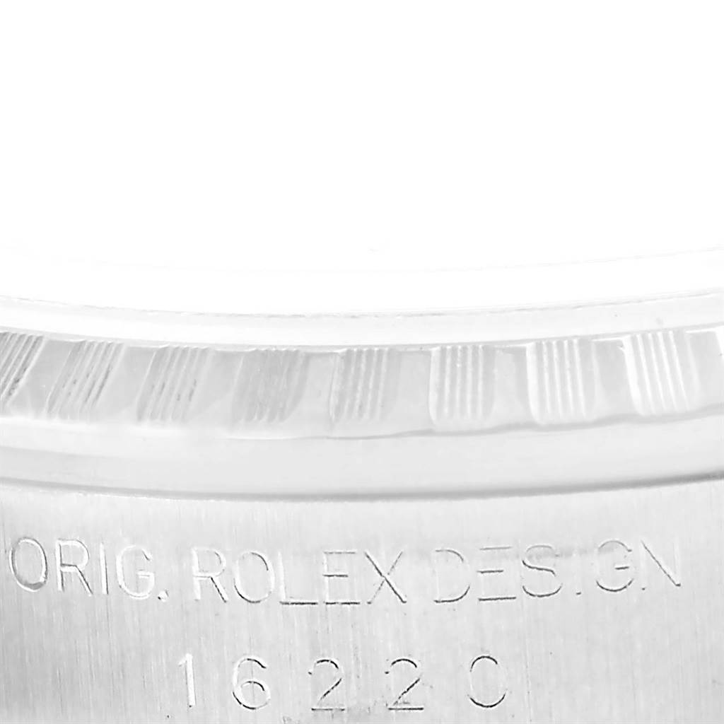The image shows a close-up of the bezel and engraved side of the Rolex Datejust 16220 Men
s Stainless Steel White Dial 16220 Men
s Stainless Steel White Dial watch case with model number.