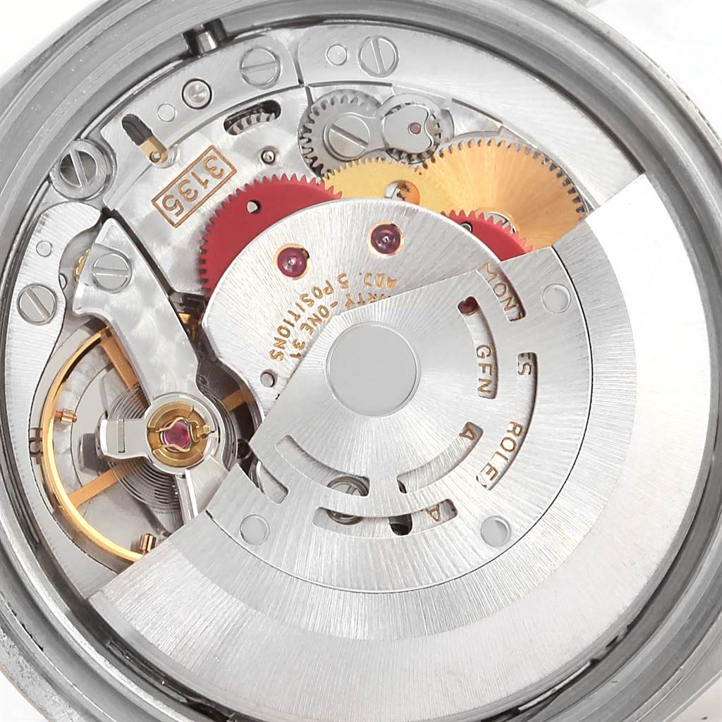 This image shows the internal movement of a Rolex Datejust 16233 Men's Steel and Gold (two tone) Champagne Dial 16233 Men's Steel and Gold (two tone) Champagne Dial watch, highlighting gears and mechanical components.