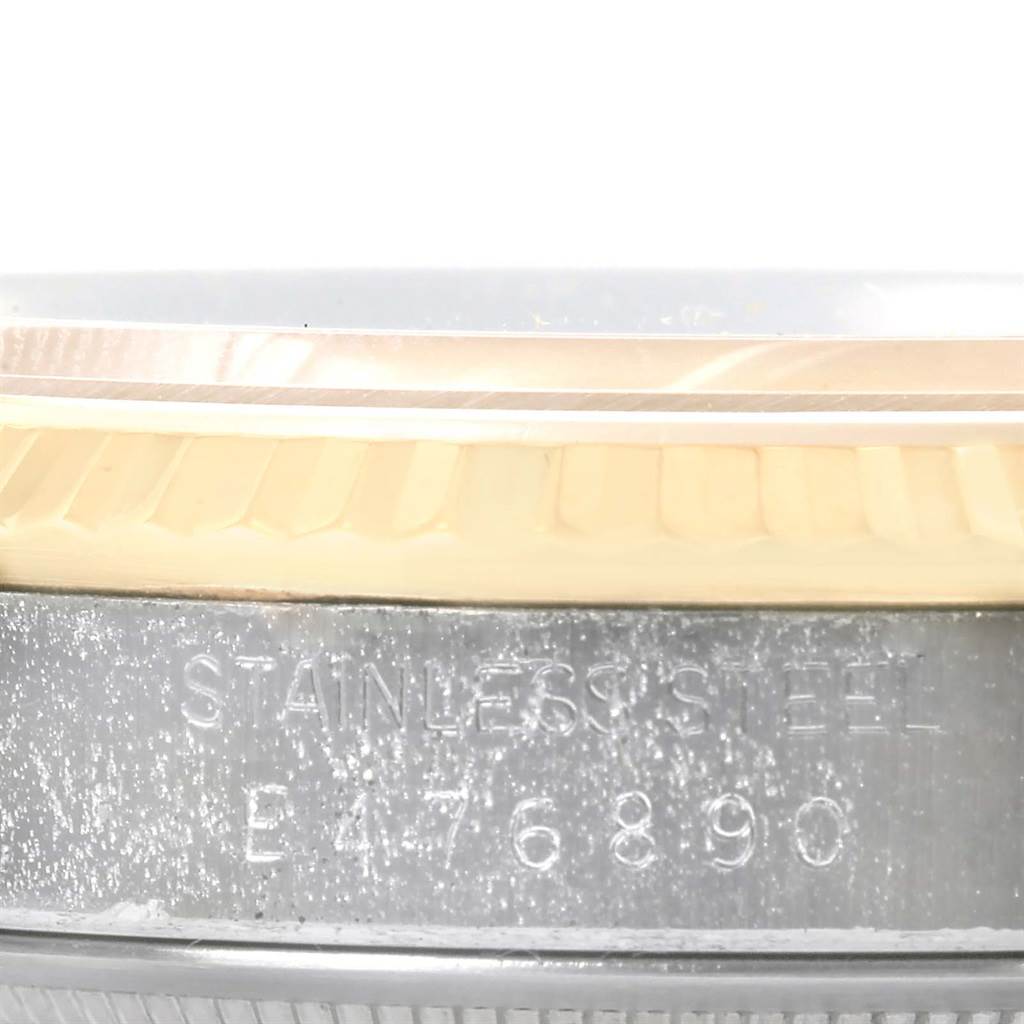 This close-up image shows the side of the case and the bezel of a Rolex Datejust 16233 Men's Steel and Gold (two tone) Champagne Dial 16233 Men's Steel and Gold (two tone) Champagne Dial watch, highlighting the stainless steel and gold details.