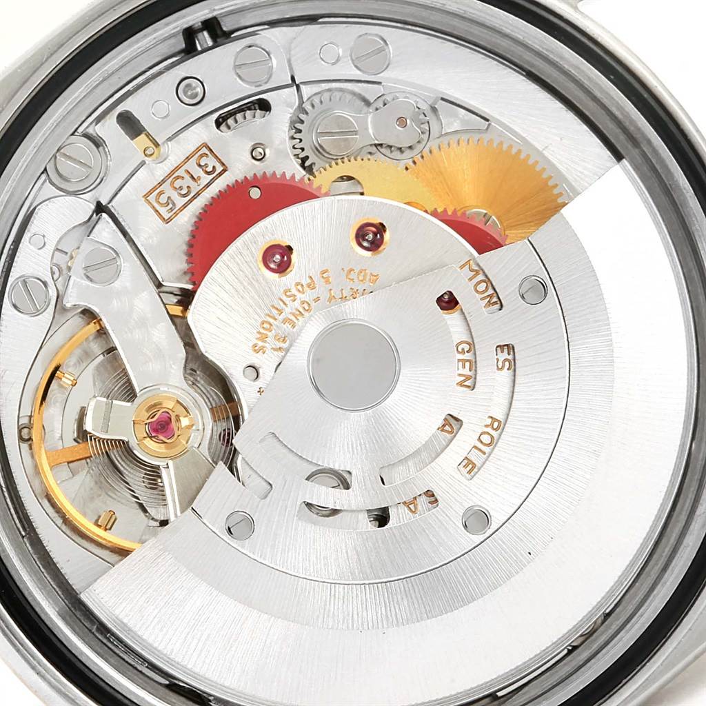 This image shows the intricate internal mechanism of the Rolex Datejust 16233 Men's Steel and Gold (two tone) Beige Dial 16233 Men's Steel and Gold (two tone) Beige Dial watch from a close-up angle.