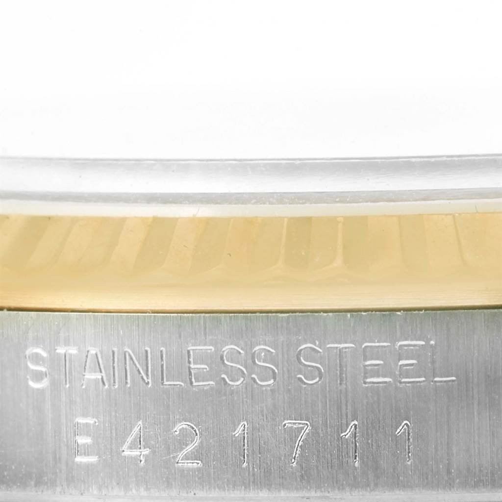 The image shows a close-up of the stainless steel case back with serial number engraving on a Rolex Datejust 16233 Men's Steel and Gold (two tone) Beige Dial 16233 Men's Steel and Gold (two tone) Beige Dial model watch.