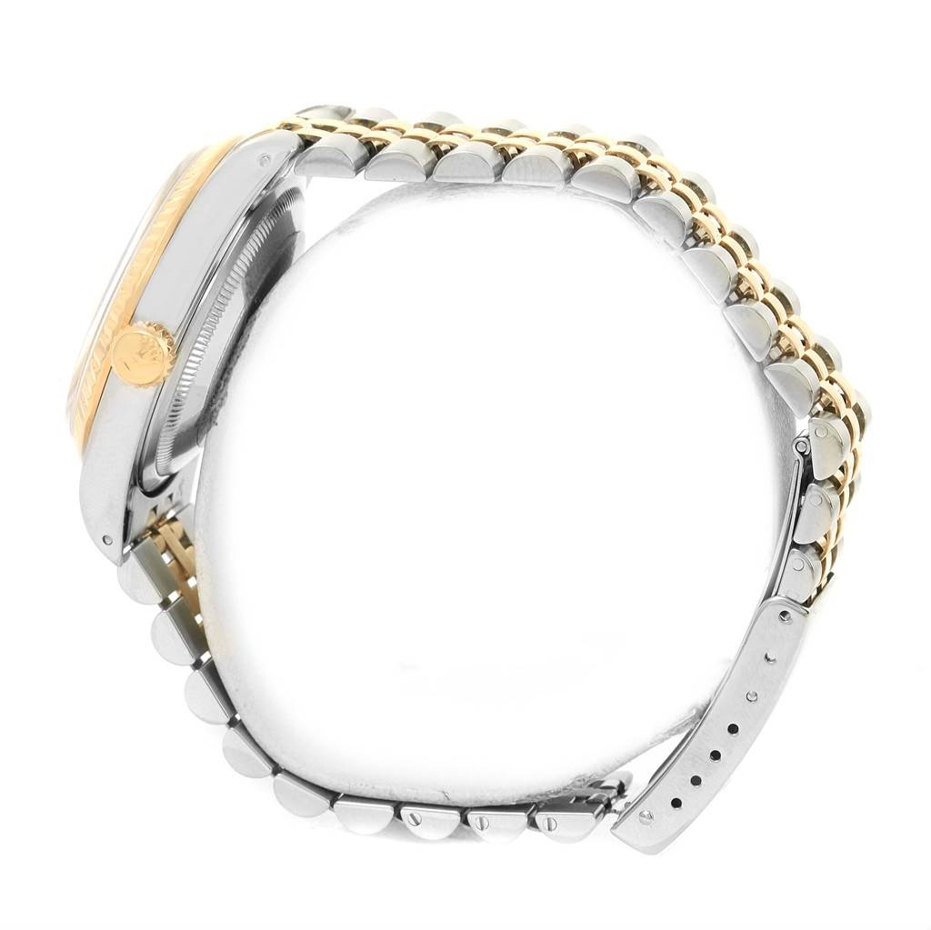 This image shows a side view of a Rolex Datejust 16233 Men's Steel and Gold (two tone) Beige Dial 16233 Men's Steel and Gold (two tone) Beige Dial watch highlighting the crown, case, and two-tone bracelet.