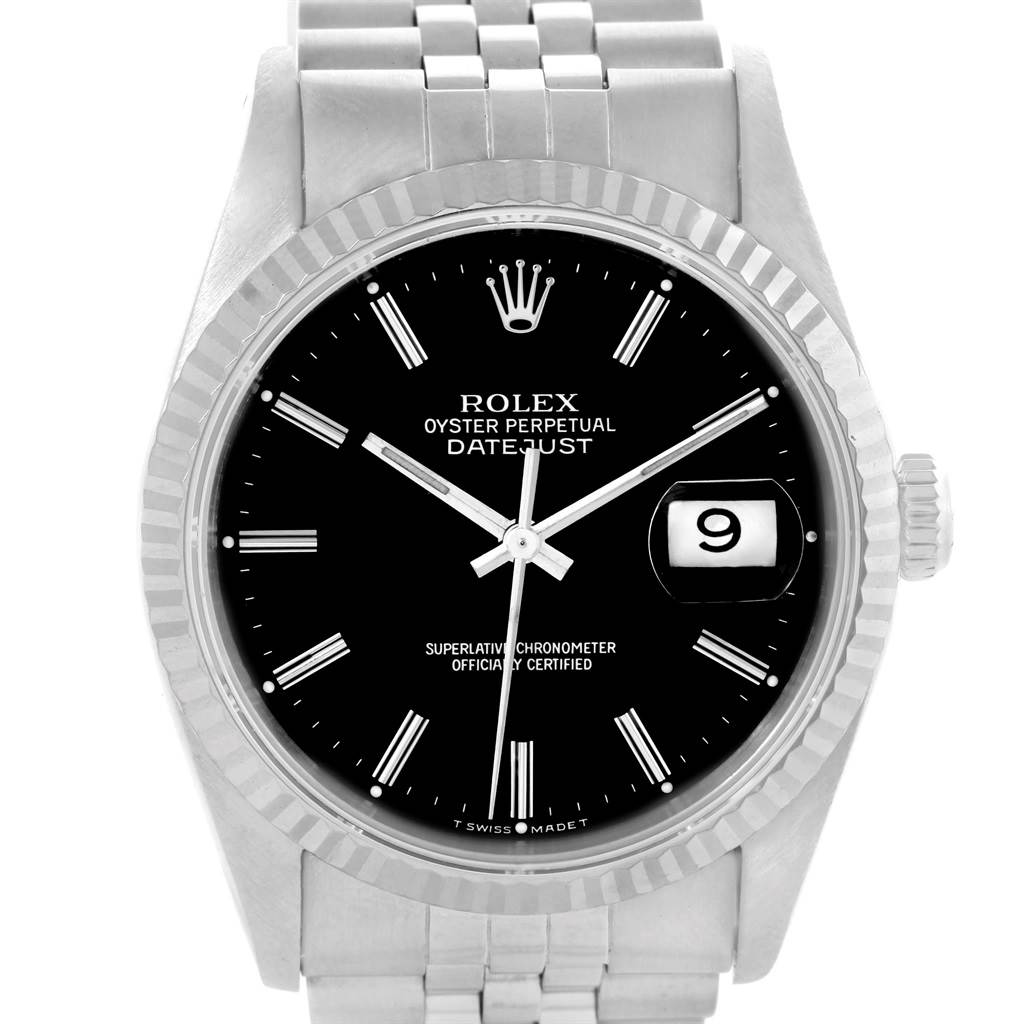 The image shows a frontal view of a Rolex Datejust 16234 Men
s Stainless Steel Silver Dial 16234 Men
s Stainless Steel Silver Dial watch, highlighting its black dial, fluted bezel, and Jubilee bracelet.