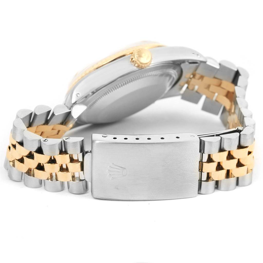 The image shows the back and side view of the Rolex Datejust 16233 Men's Steel and Gold (two tone) Champagne Dial 16233 Men's Steel and Gold (two tone) Champagne Dial watch, highlighting its clasp and bracelet.