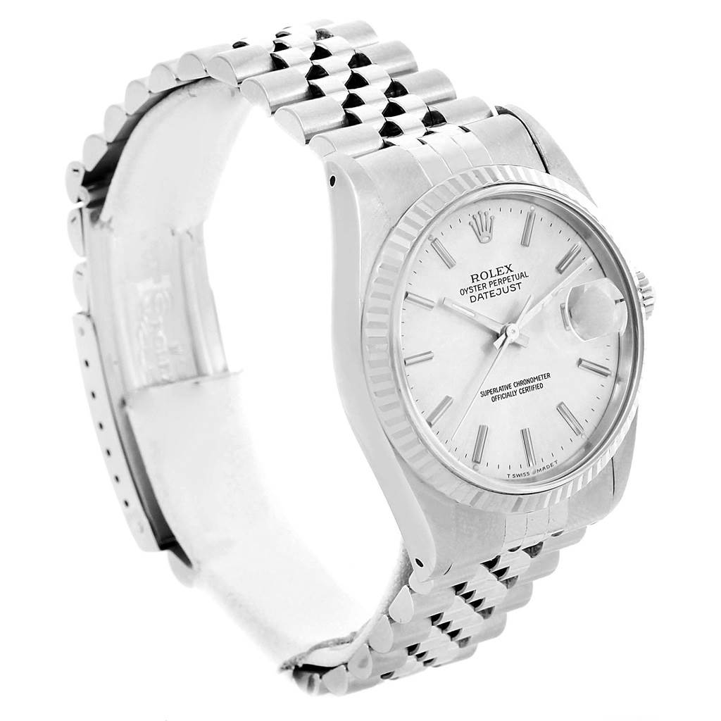 The Rolex Datejust 16234 Men
s Stainless Steel Silver Dial 16234 Men
s Stainless Steel Silver Dial watch is shown at an angle highlighting its face, bezel, and partially open bracelet.