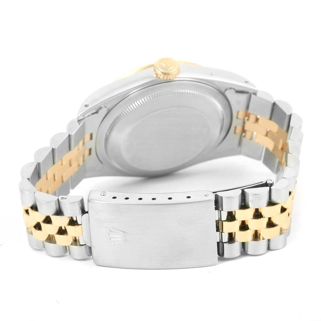 The image shows the back of a Rolex Datejust 16233 Men's Steel and Gold (two tone) Champagne Dial 16233 Men's Steel and Gold (two tone) Champagne Dial watch, including the clasp and bracelet with two-tone metal links.