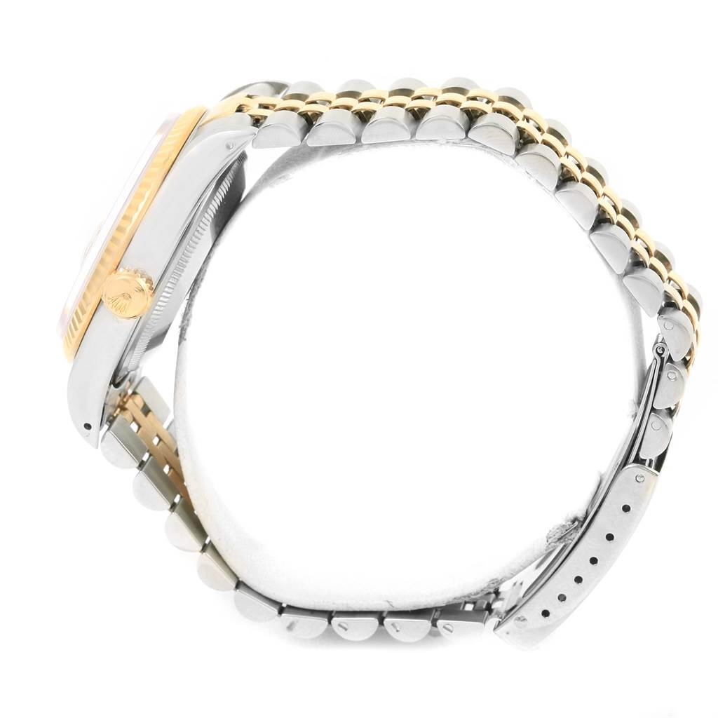 This image shows a side view of the Rolex Datejust 16233 Men
s Steel and Gold (two tone) Black Dial 16233 Men
s Steel and Gold (two tone) Black Dial model, featuring its crown, bezel, and bracelet.