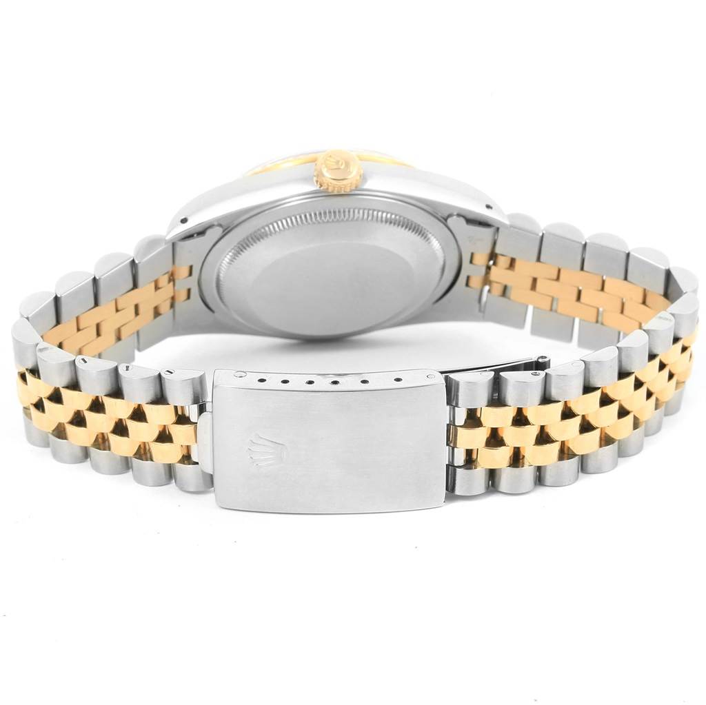 This image shows the back view of a Rolex Datejust 16233 Men
s Steel and Gold (two tone) Black Dial 16233 Men
s Steel and Gold (two tone) Black Dial watch, highlighting the two-tone metal bracelet and clasp.