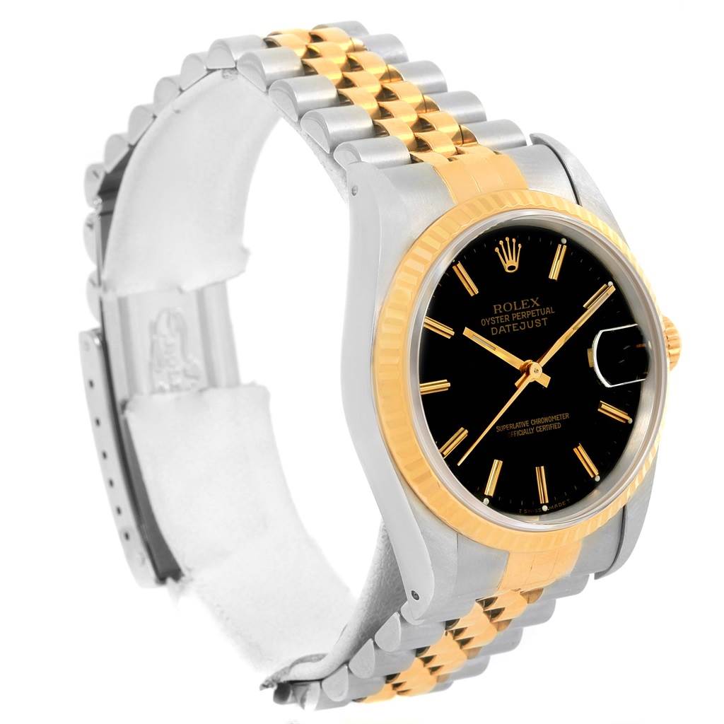 The image shows a Rolex Datejust 16233 Men
s Steel and Gold (two tone) Black Dial 16233 Men
s Steel and Gold (two tone) Black Dial watch at a slight side angle, highlighting the two-tone bracelet, bezel, and black dial with gold accents.