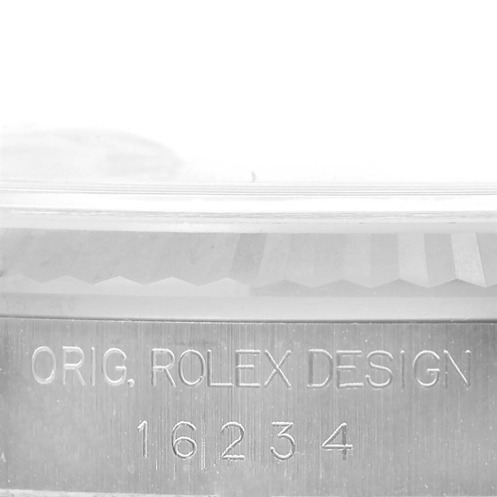 The image shows a close-up of the side of a Rolex Datejust 16234 Men's Stainless Steel Silver Dial 16234 Men's Stainless Steel Silver Dial watch case, displaying the engraved text and model number "16234."