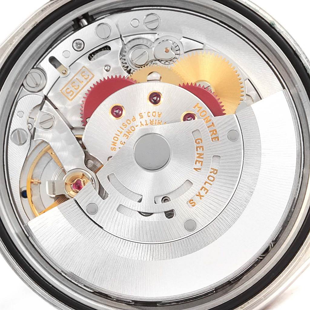 This image shows an up-close view of the Rolex Datejust 16234 Men's Stainless Steel Silver Dial 16234 Men's Stainless Steel Silver Dial movement mechanism, highlighting gears and the rotor.