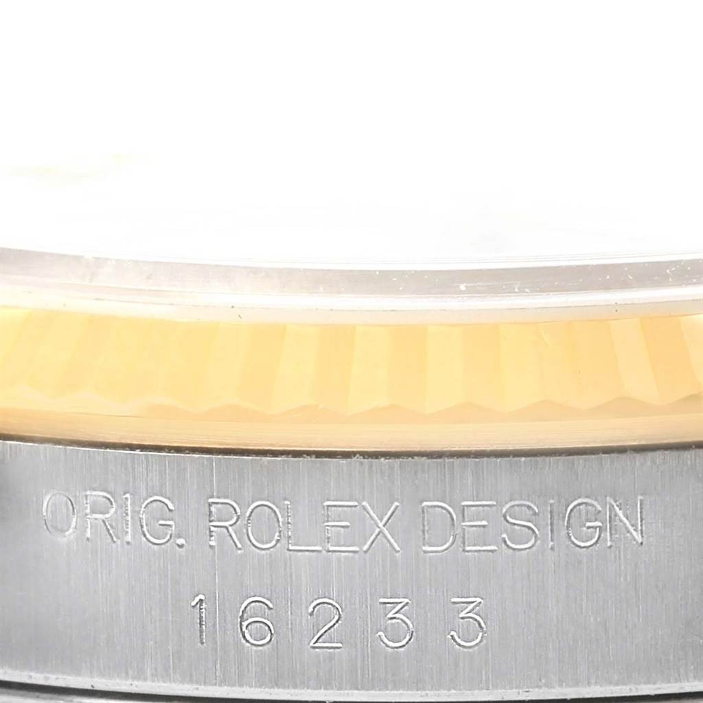 The image shows a close-up of the side, bezel, and case of a Rolex Datejust 16233 Men's Steel and Gold (two tone) Champagne Dial 16233 Men's Steel and Gold (two tone) Champagne Dial model watch.