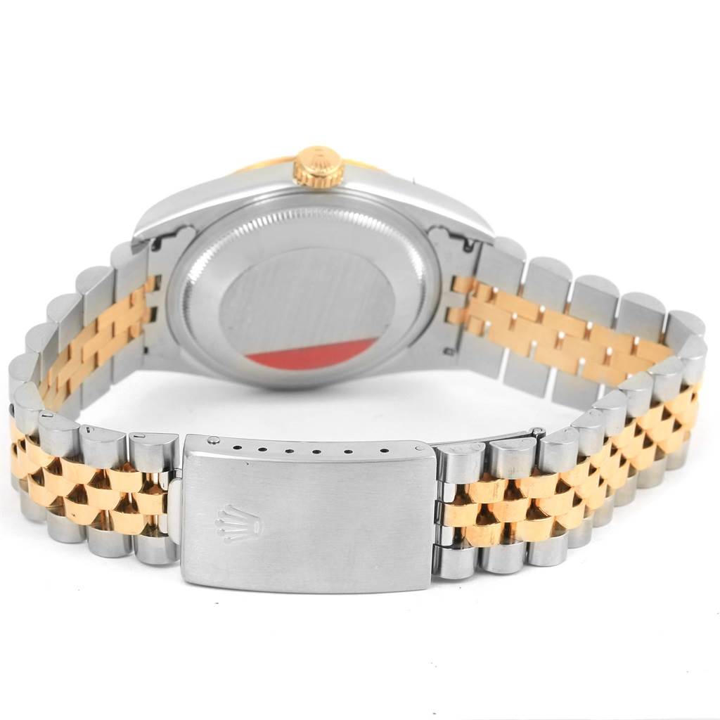 This image shows the back, clasp, case, and two-toned bracelet of a Rolex Datejust 16233 Men's Steel and Gold (two tone) Champagne Dial 16233 Men's Steel and Gold (two tone) Champagne Dial watch.