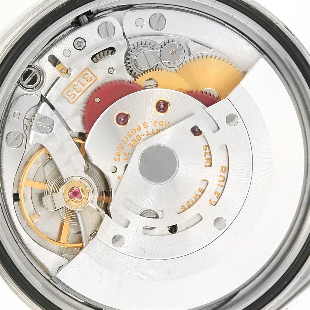 This close-up image shows the intricate mechanical movement inside a Rolex Datejust 16200 Men
s Stainless Steel White Dial 16200 Men
s Stainless Steel White Dial watch.