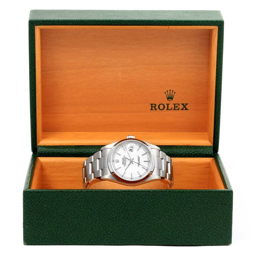 The Rolex Datejust 16200 Men
s Stainless Steel White Dial 16200 Men
s Stainless Steel White Dial watch is displayed at a straight-on angle inside an open green and wood box.