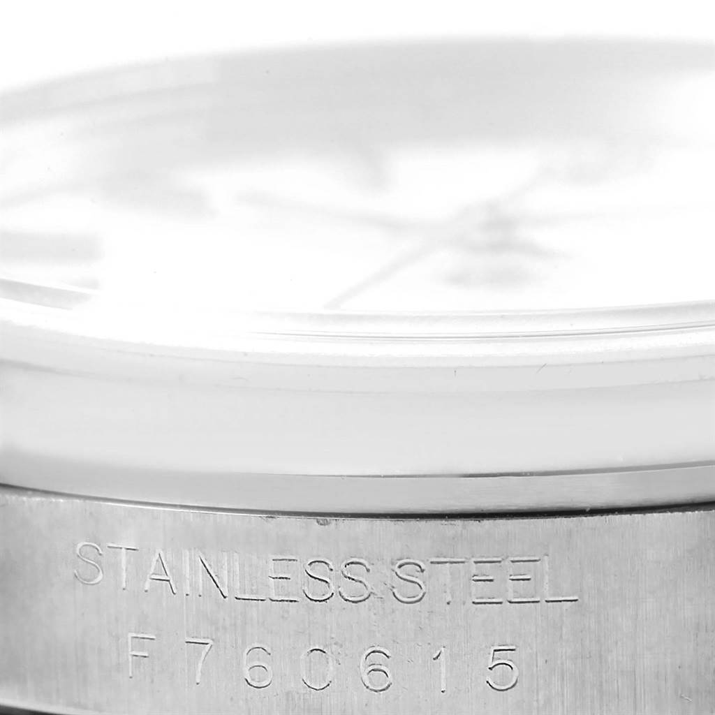 This image shows a close-up of the side of a Rolex Datejust 16200 Men
s Stainless Steel White Dial 16200 Men
s Stainless Steel White Dial watch, highlighting the stainless steel case and serial number.