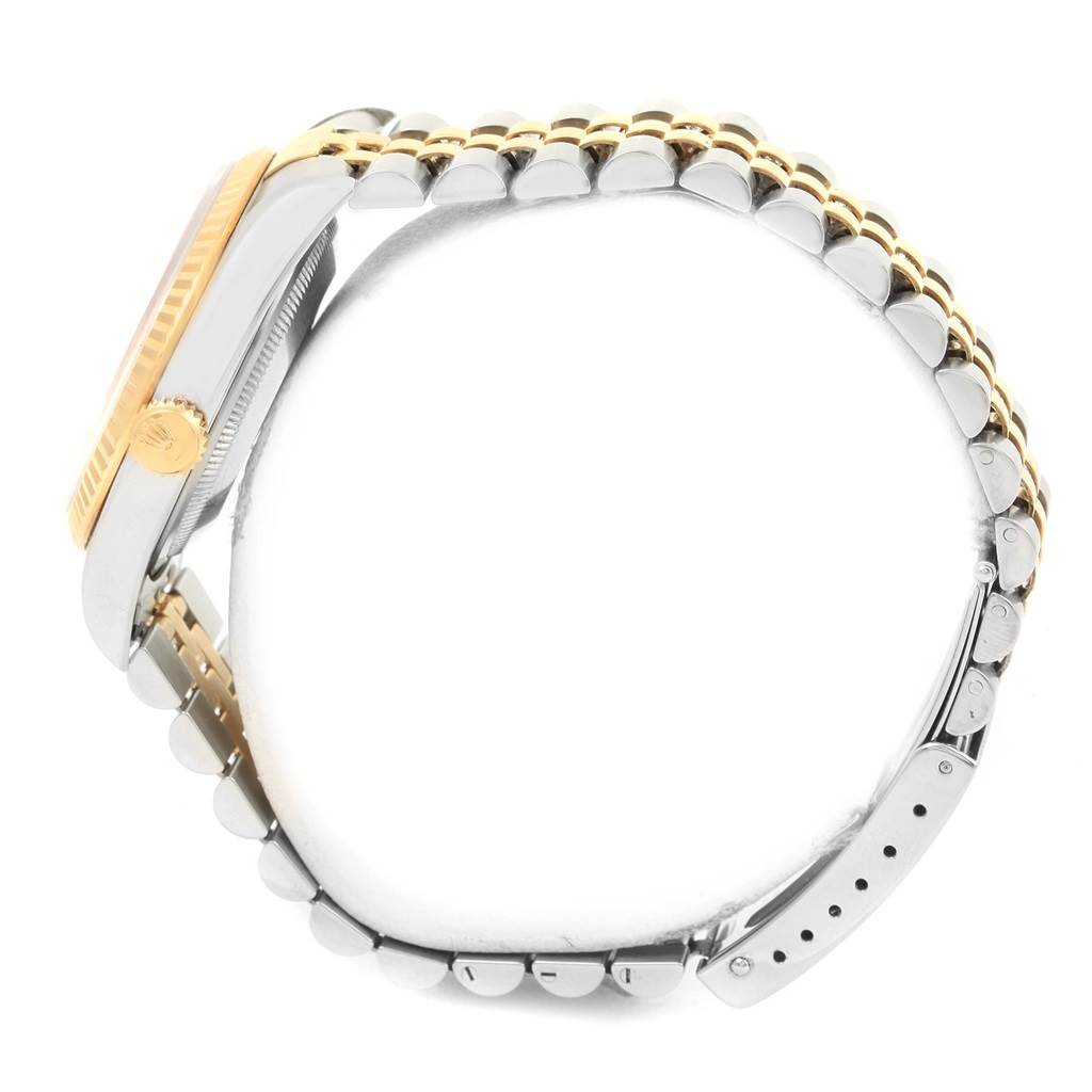 The image shows the side view of a Rolex Datejust 16233 Men's Steel and Gold (two tone) Champagne Dial 16233 Men's Steel and Gold (two tone) Champagne Dial watch, highlighting the crown, case, and two-tone bracelet.