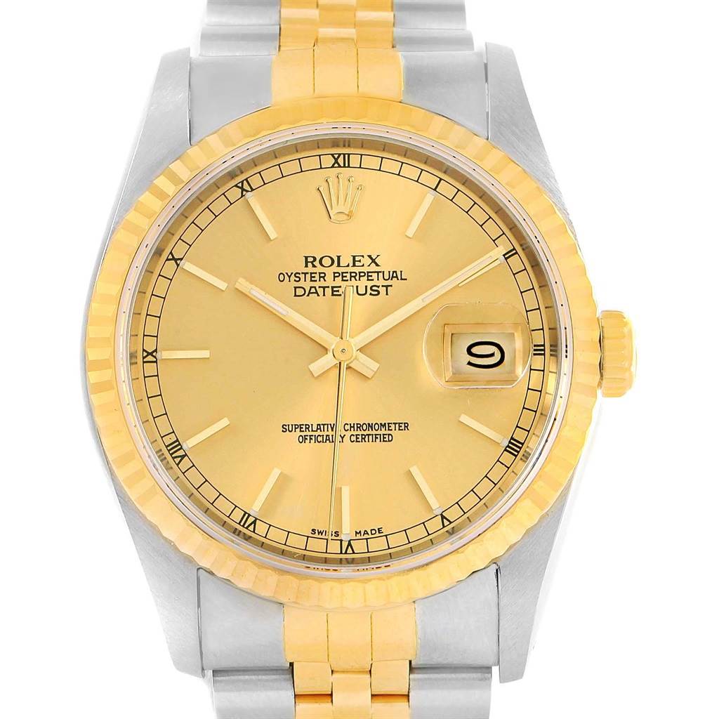 This image shows a Rolex Datejust 16233 Men's Steel and Gold (two tone) Champagne Dial 16233 Men's Steel and Gold (two tone) Champagne Dial watch from a front-facing angle, highlighting its gold dial, fluted bezel, date window, and two-tone bracelet.
