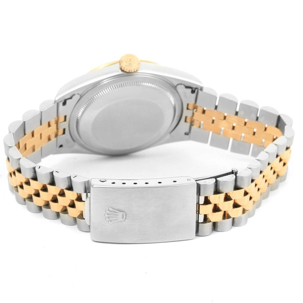 The image shows the back view of a Rolex Datejust 16233 Men's Steel and Gold (two tone) Champagne Dial 16233 Men's Steel and Gold (two tone) Champagne Dial watch, highlighting its two-tone bracelet and clasp.