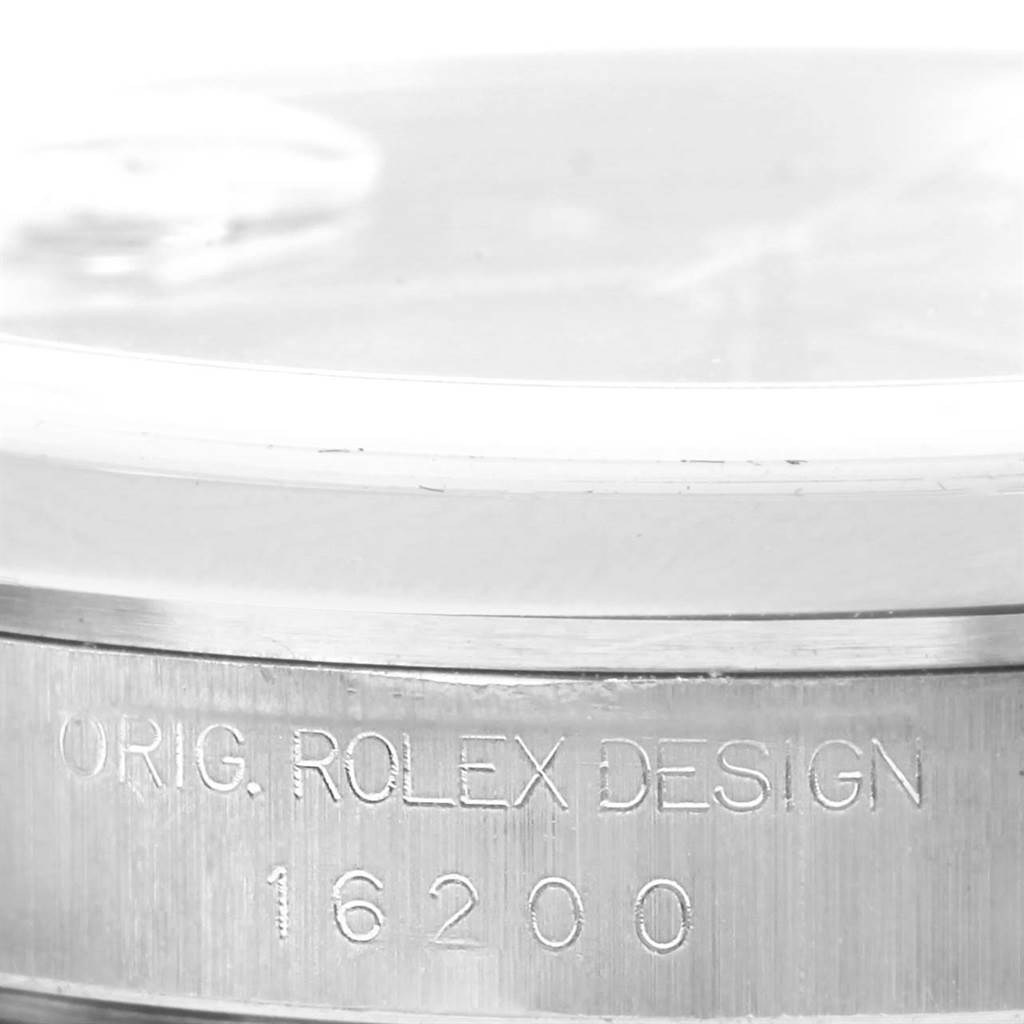 This close-up image shows the side of the case of a Rolex Datejust 16200 Men's Stainless Steel Blue Dial 16200 Men's Stainless Steel Blue Dial, highlighting the engraved design model number 16200.