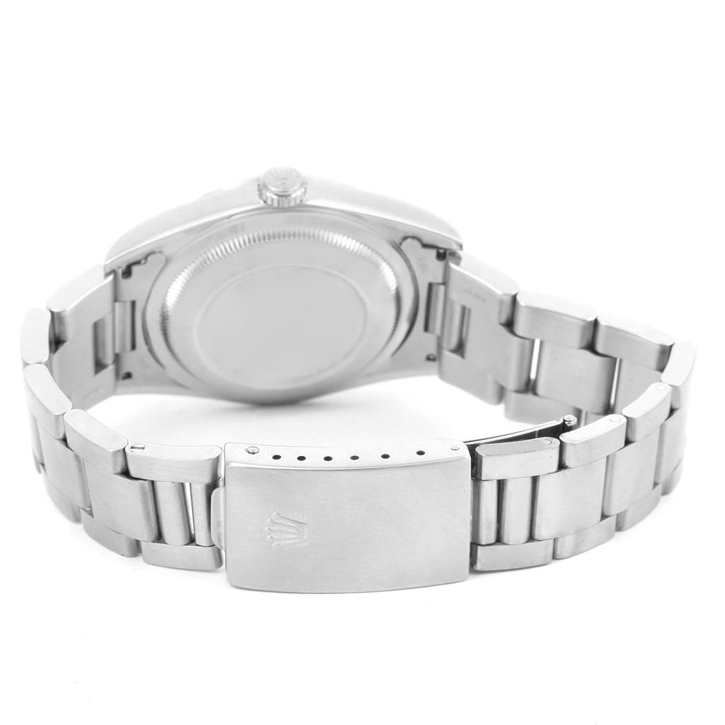 The image shows the back view of a Rolex Datejust 16200 Men's Stainless Steel Blue Dial 16200 Men's Stainless Steel Blue Dial watch, highlighting the case back, crown, and metal bracelet with the clasp.