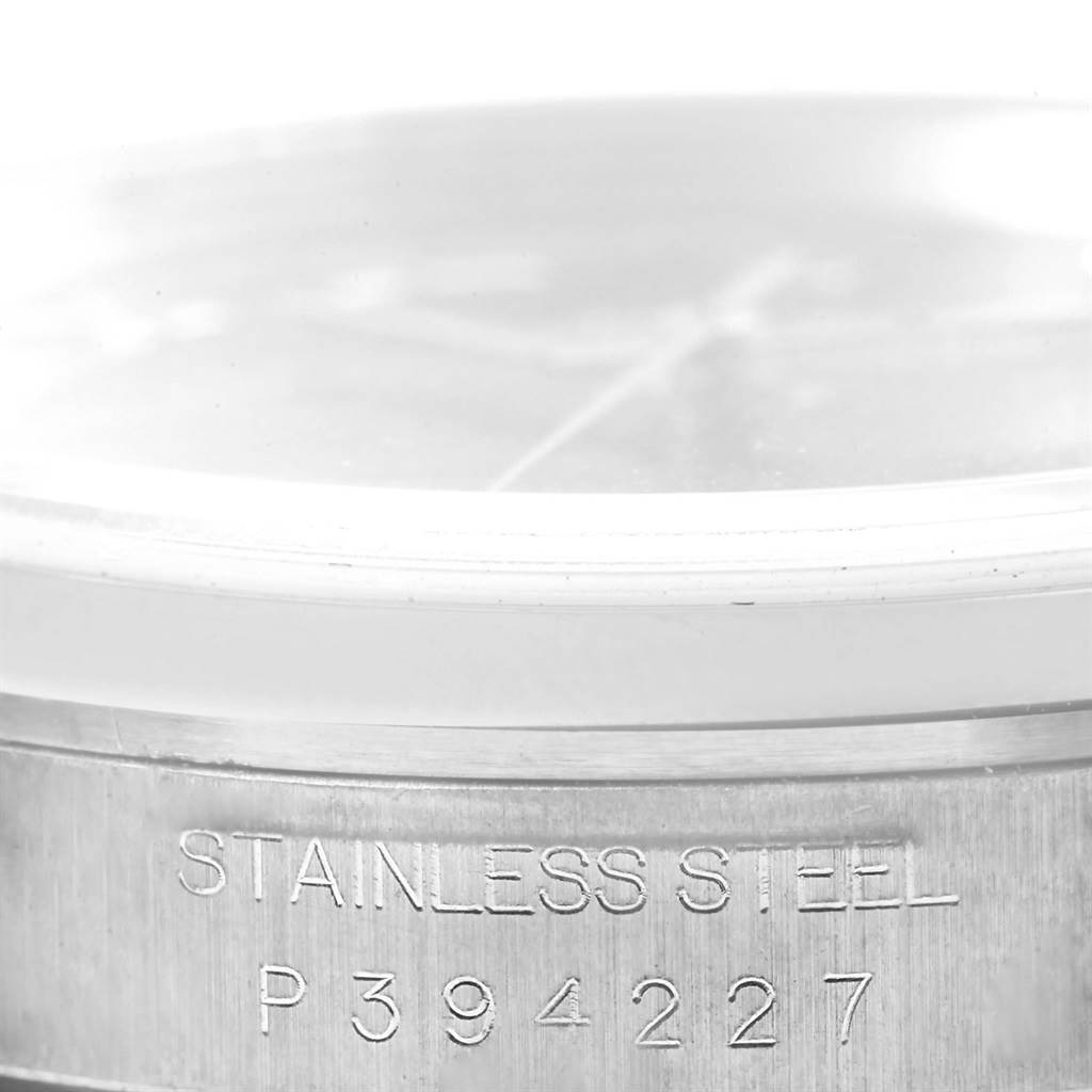 This close-up image of the Rolex Datejust 16200 Men's Stainless Steel Blue Dial 16200 Men's Stainless Steel Blue Dial watch shows the side angle with the stainless steel casing and serial number "P394227."