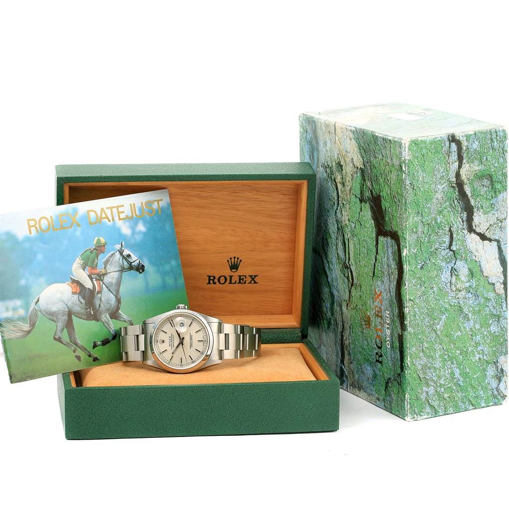 The image shows a Rolex Datejust 16200 Men's Stainless Steel Silver Dial 16200 Men's Stainless Steel Silver Dial watch in its original green and wood box alongside an instruction booklet and the outer box.