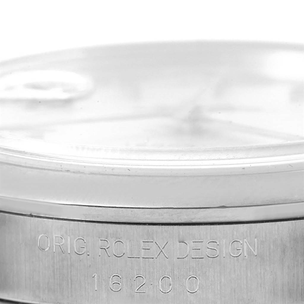 The image shows a close-up of the side of a Rolex Datejust 16200 Men's Stainless Steel Silver Dial 16200 Men's Stainless Steel Silver Dial, highlighting the bezel, case, and model engraving (16200).