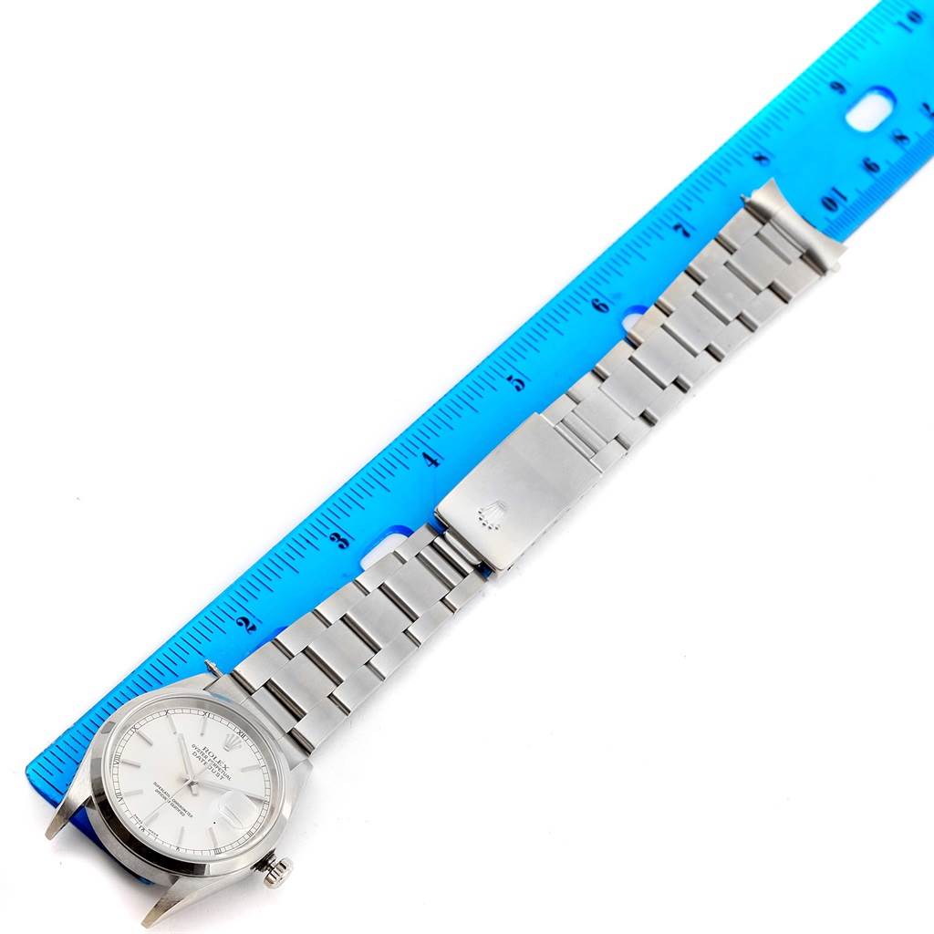 The image shows a Rolex Datejust 16200 Men's Stainless Steel Silver Dial 16200 Men's Stainless Steel Silver Dial watch placed next to a ruler, displaying the face, bracelet, and clasp from a top-down angle.