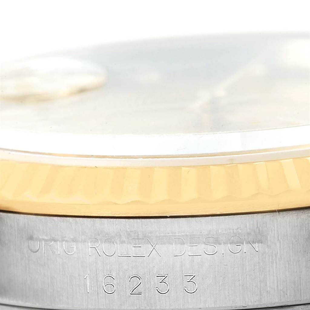 This image shows a close-up of the bezel, crystal, and part of the case with the model number "16233" of a Rolex Datejust 16233 Men's Steel and Gold (two tone) Champagne Dial 16233 Men's Steel and Gold (two tone) Champagne Dial watch.