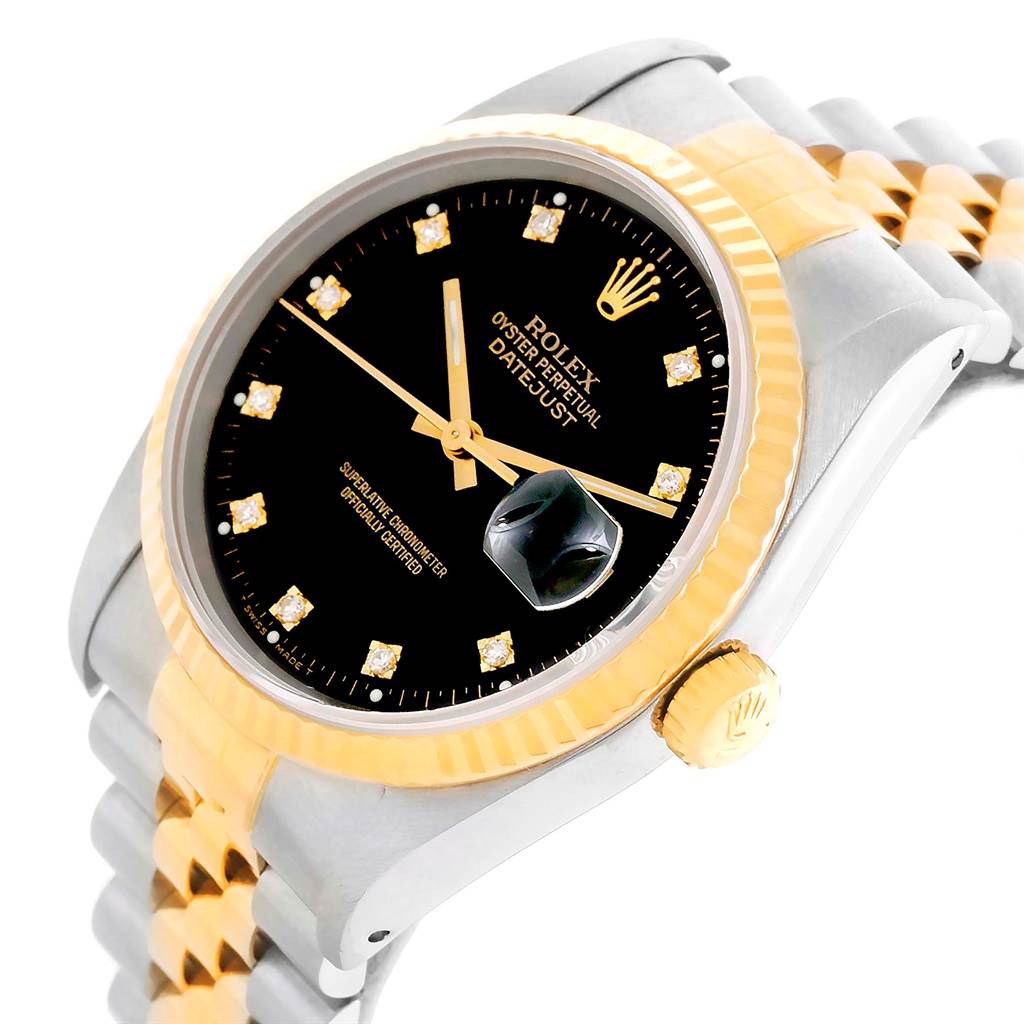 This image shows a close-up angle of a Rolex Datejust 16233 Men's Steel and Gold (two tone) Black Dial 16233 Men's Steel and Gold (two tone) Black Dial watch, highlighting its black dial, two-tone bracelet, and fluted bezel.