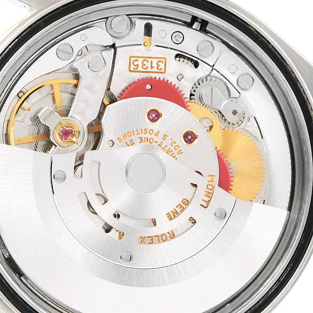 The image shows a close-up of the internal mechanism and movement parts of a Rolex Datejust 16233 Men's Steel and Gold (two tone) Black Dial 16233 Men's Steel and Gold (two tone) Black Dial watch.