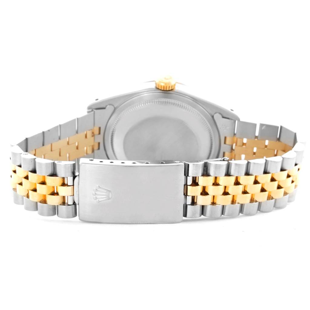 The image shows the back and clasp of a Rolex Datejust 16233 Men's Steel and Gold (two tone) Black Dial 16233 Men's Steel and Gold (two tone) Black Dial watch, highlighting its two-tone bracelet.