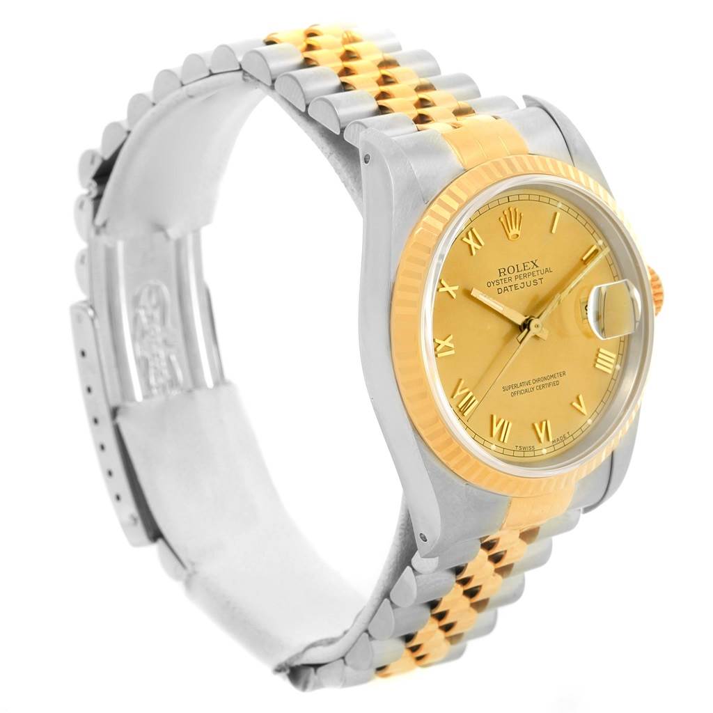 The Rolex Datejust 16233 Men's Steel and Gold (two tone) Champagne Dial 16233 Men's Steel and Gold (two tone) Champagne Dial watch is shown at an oblique angle, displaying the gold dial, bezel, and two-tone bracelet.