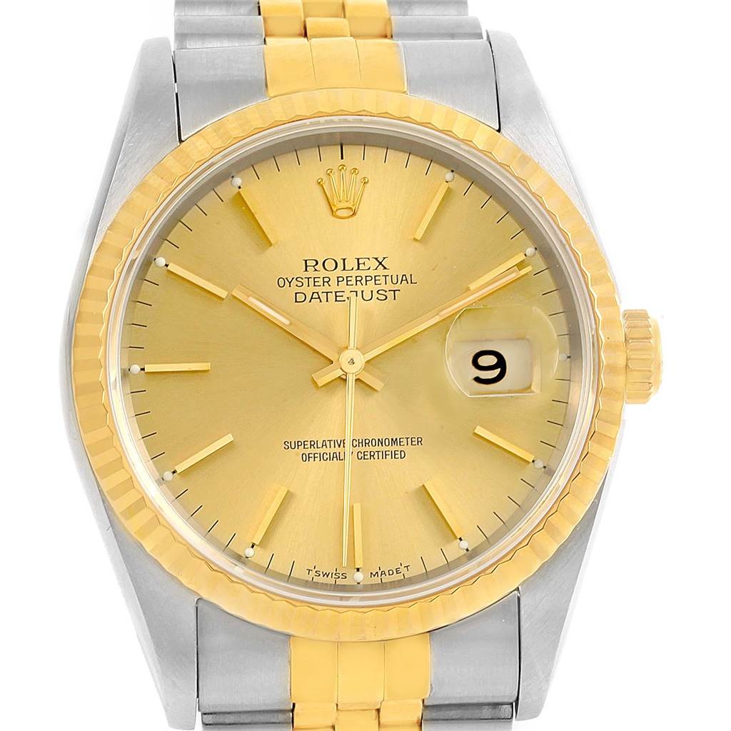 This image shows the face, bezel, and part of the bracelet of a Rolex Datejust 16233 Men's Steel and Gold (two tone) Champagne Dial 16233 Men's Steel and Gold (two tone) Champagne Dial watch.