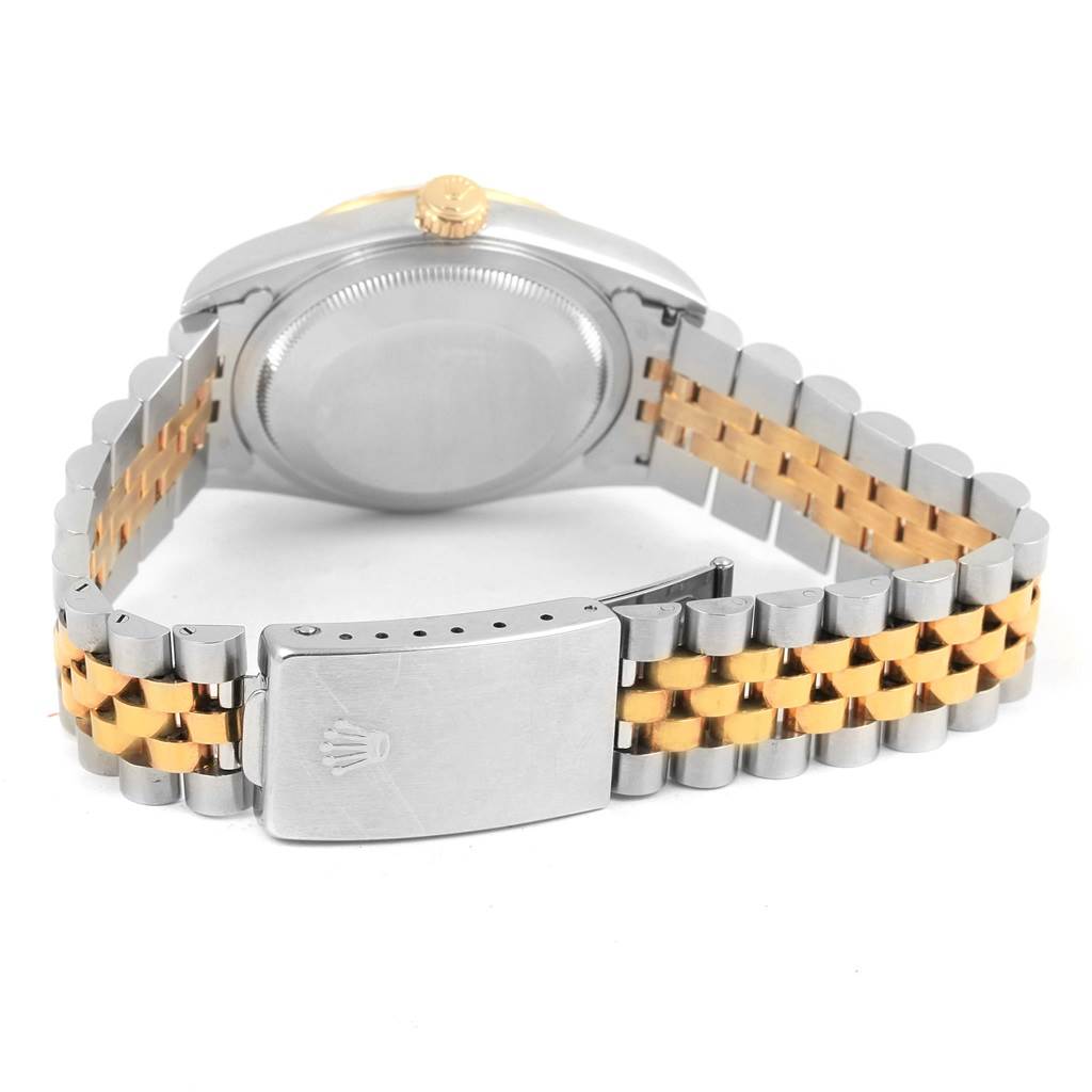 The image shows the back of a Rolex Datejust 16233 Men's Steel and Gold (two tone) Champagne Dial 16233 Men's Steel and Gold (two tone) Champagne Dial watch, focusing on its two-tone metal bracelet and clasp.