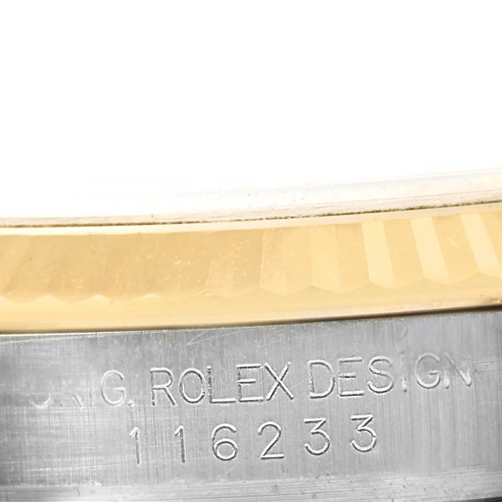 This image shows a close-up of the fluted bezel and case with engraved model number of a Rolex Datejust 116233 Men's Stainless Steel Grey Dial 116233 Men's Stainless Steel Grey Dial watch.