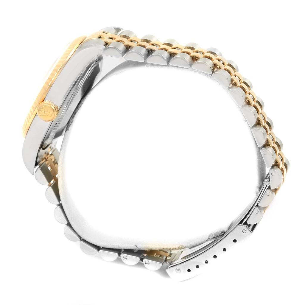 This image shows a side view of a Rolex Datejust 16233 Men's Steel and Gold (two tone) White Dial 16233 Men's Steel and Gold (two tone) White Dial watch, highlighting the crown and two-tone jubilee bracelet.